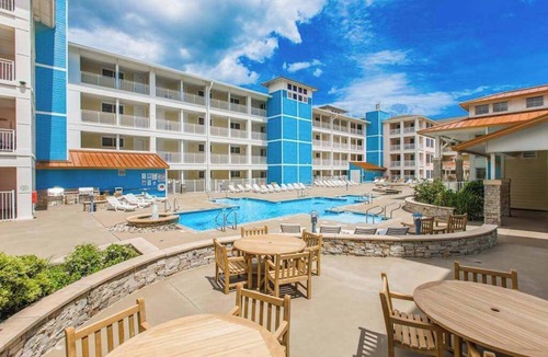 Sandbridge Condo | 2nd-floor bay- & ocean-view condo with balcony, outdoor pool, grills & gym