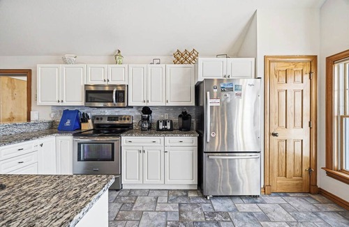 Buck Island House | Big Blue 10 | 1,625 ft to the beach | Hot Tub, Dog Friendly, and Community Pool