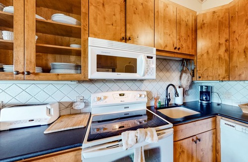 Whitefish Condo | Chic condo with private space on the beach, pool, hot tub & sauna
