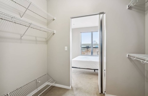 Mill District Apartment | CozySuites Mill District with pool, gym # 09