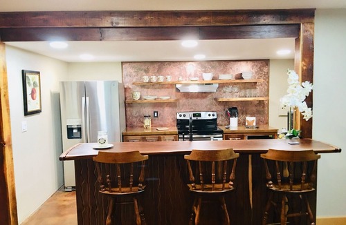Missoula House | Guest suite attached to log home in the FOREST