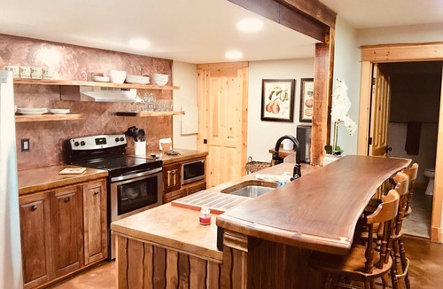 Missoula House | Guest suite attached to log home in the FOREST