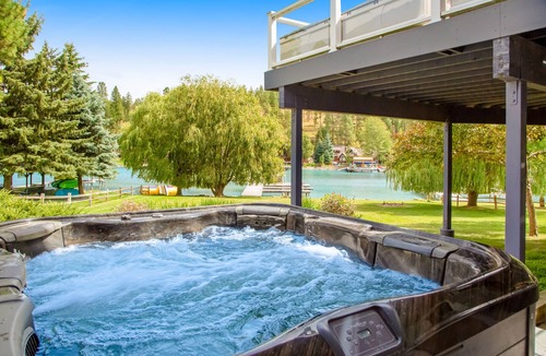 Lakeside House | Lakefront home with dock, lake views, Ping-Pong, outdoor kitchen, private beach