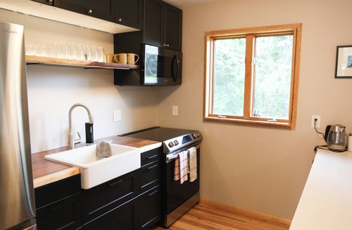 Upper Rattlesnake House | Modern dog-friendly retreat, with large deck, gardens, pond, and trails.