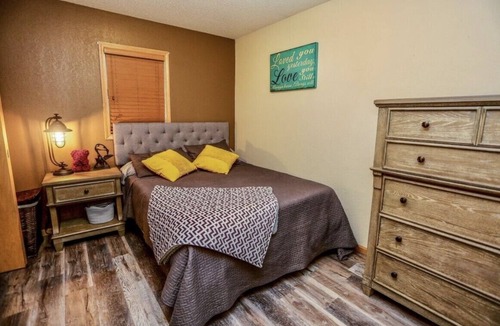 Aberdeen House | OurCozyOasis, Relax in the warmth of the fireplace in this homey upstairs.