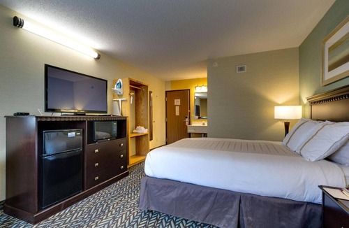 Devils Lake Hotel | Queen Bed Suite near Roosevelt Park | Free Parking & Year-Round Pool Access!
