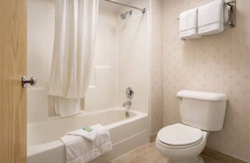 Devils Lake Hotel | Queen Bed Suite near Roosevelt Park | Free Parking & Year-Round Pool Access!