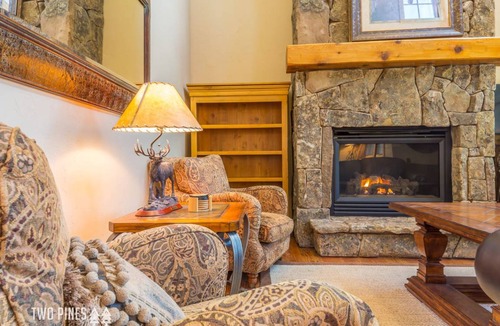 Big Sky House | Trotwood Townhome Cozy up to the Fireplace on a Snowy Night!