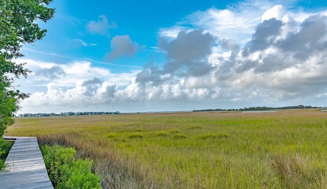 As you enter, the Bald Head Creek and marsh vistas-through the walls of windows-catch your eye.